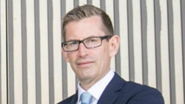 Martin Whelan - CEO of the Housing Agency pictured in a suit