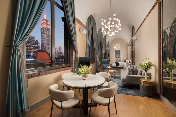 a room with a table and chairs