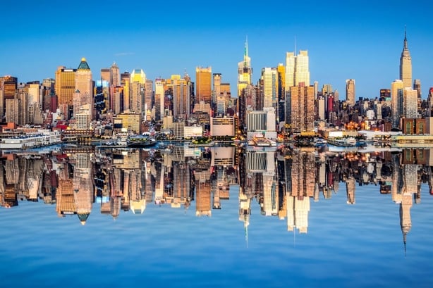 The New York city skyline reflected in water
