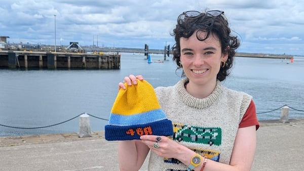 a person holding a hat