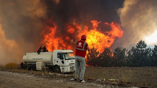 BURSA, TURKIYE - JULY 28: Flames and thick smoke rise from a wildfire in the Orhaneli district of Bursa, Turkiye, as firefighters battle to bring the blaze under control on its third day on July 28, 2025. Strong winds have hindered containment. (Photo by