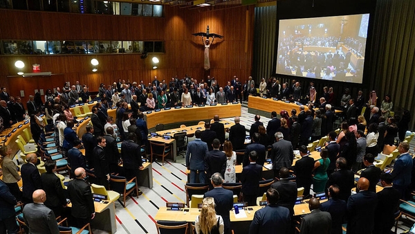 Attendees stand during a moment of silence during a ministerial high level meeting during the United Nations conference on a two state solution for Israel and the Palestinians, at UN headquarters on July 28, 2025, in New York City. Ever since the partitio