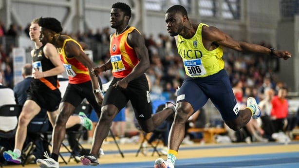 23 February 2025; Bori Akinola of UCD AC, Dublin, right, crosses the line to win the men's 60m final ahead of Israel Olatunde of Tallaght AC, Dublin, centre, who finished third, during day two of the 123.ie National Senior Indoor Championships at the National Indoor Arena on the Sport Ireland Campus
