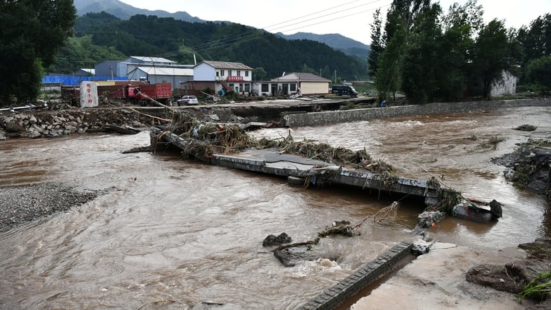 A bridge in Beijing was badly damaged by floods