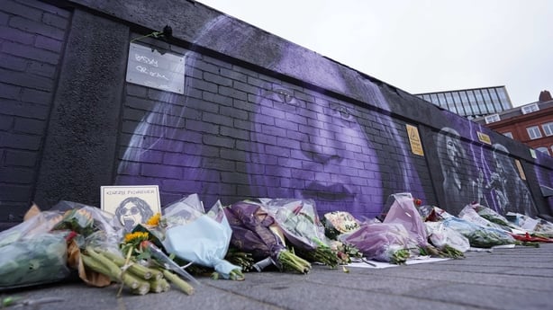 Flowers, notes, and floral tributes placed on the Black Sabbath Bridge bench are seen in Birmingham on 24 July, 2025, in memory of Ozzy Osbourne, the iconic frontman of Black Sabbath band and one of the most influential figures in British heavy metal music