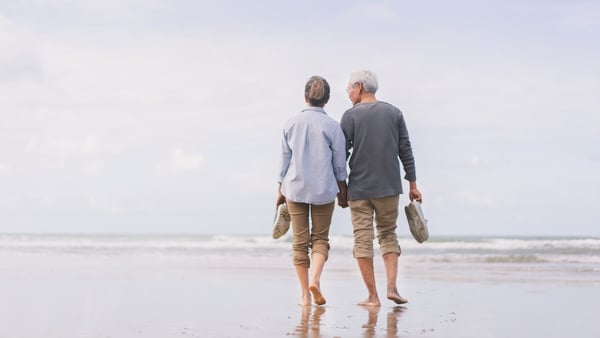 Stock image of a happy senior couple at the beach.