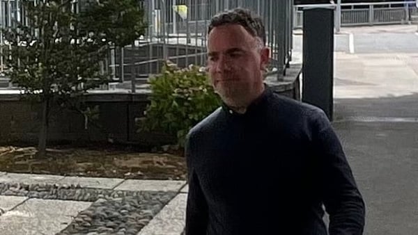 Gary Rooney pictured walking on a footpath