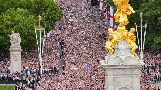 Fans gather during a Homecoming Victory Parade on the Mall, London