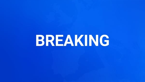 A blue background with white text saying Breaking