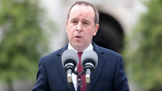 A view of John Cummins speaking outside Government Buildings