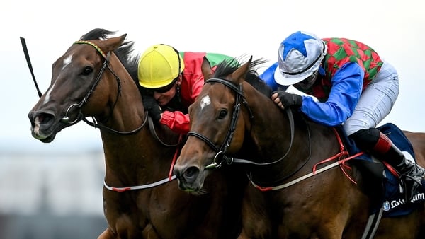 29 July 2025; Dunum, with Seamie Heffernan up, left, on their way to winning the COLM QUINN BMW Mile Handicap from second placed Bear Profit, with Nicola Burns up, during day two of the Galway Races Summer Festival at Ballybrit Racecourse in Galway. Photo