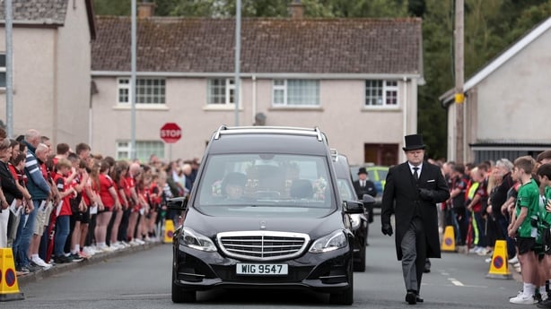 Funeral cortege carrying remains of three people in maguiresbridge Fermanagh
