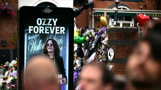 Mourners and music fans line the streets to pay their respects ahead of the funeral cortège of Ozzy Osbourne in Birmingham on 30 July, 2025