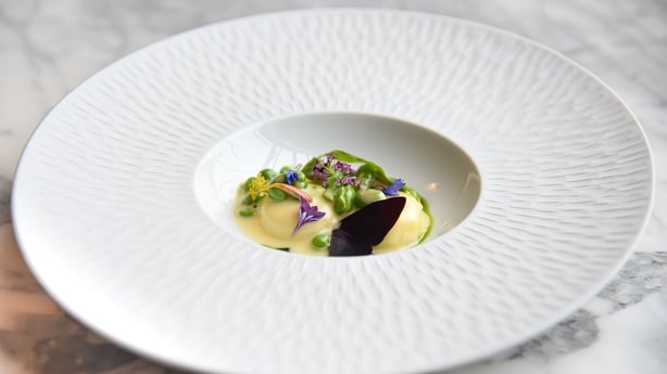 a plate of food on a marble table