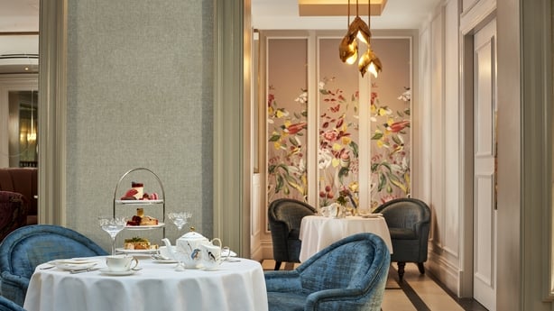 Afternoon tea floral wall with pendant light in background