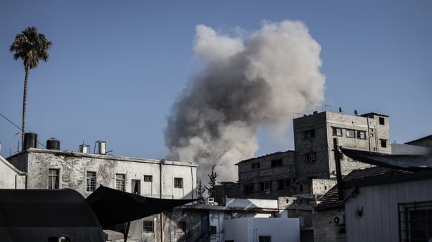 Smoke and dust rise from residential areas following the Israeli army's attack on the Shuja'iyya neighborhood