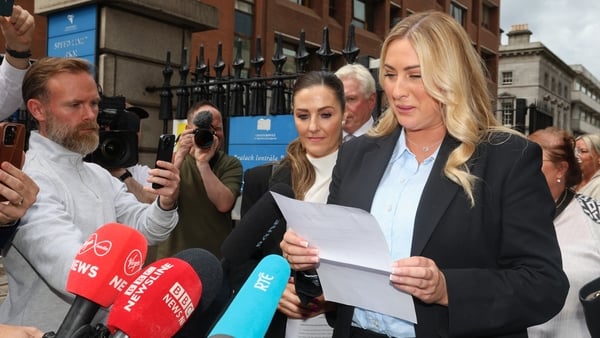 Nikita Hand reading a statement to press after leaving the High Court