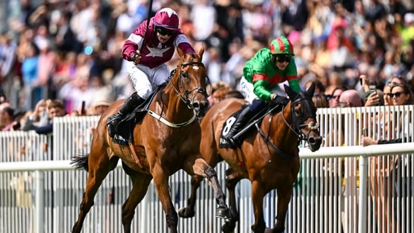 Gold Dancer, left, with Sean O'Keeffe up, on their way to winning the Guinness Open Gate Brewery Novice Steeplechase during day four of the Galway Races Summer Festival at Ballybrit Racecourse in Galway.