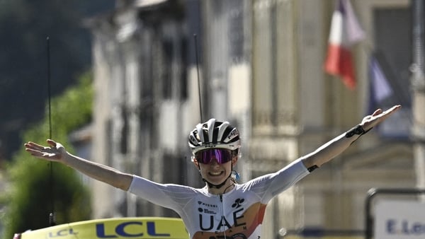 UAE Team ADQ's French rider Maeva Squiban celebrates as she crosses the finish line to win the 6th stage (out of 9) of the fourth edition of the Women's Tour de France cycling race, 123.7 km from Clermont-Ferrand to Ambert, in Ambert, central France on Ju