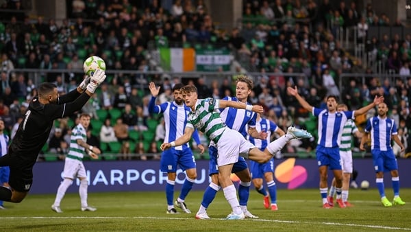 31 July 2025; John McGovern of Shamrock Rovers has a header on goal saved by St Joseph's goalkeeper Bradley Banda during the UEFA Conference League Second Qualifying Round second leg match between Shamrock Rovers and St Joseph's at Tallaght Stadium in Dub