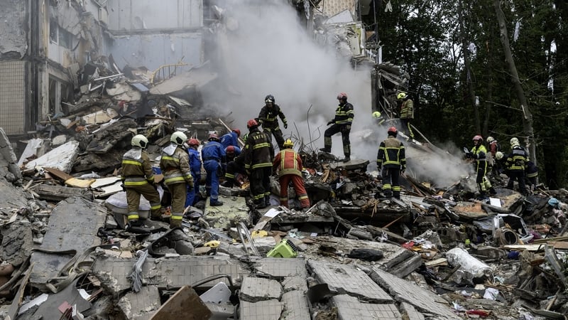 Rescuers are seen working through rubble following a Russian strike on Kyiv