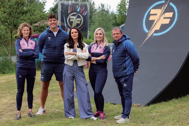 Sonia O'Sullivan, Donncha O'Callaghan, Laura Fox, Anna Gear and Davy Fitz posing for a photo on the Ireland's Fittest Family set