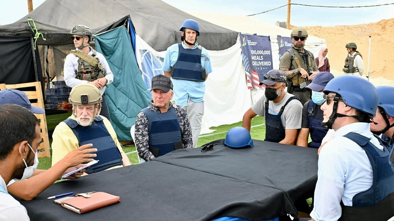 Steve Witkoff, wearing black cap, at an aid distribution site run by the Gaza Humanitarian Foundation in Gaza (Credit: X - Mike Huckabee - @ISAmbIsrael)