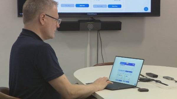 Kevin Magee, Chief Technology Officer of All human working on their latest AI project on a laptop