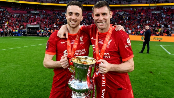 Diogo Jota and James Milner of Liverpool with the Emirates FA Cup at the end of The FA Cup Final match between Chelsea and Liverpool