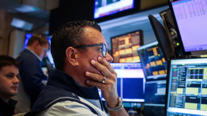 Traders work on the floor of the New York Stock Exchange in the US