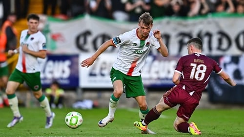 Cork City's Alex Nolan is tackled by Robert Burns