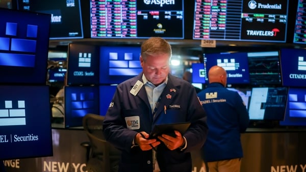 A trader on the the floor of the New York Stock Exchange on 1 August