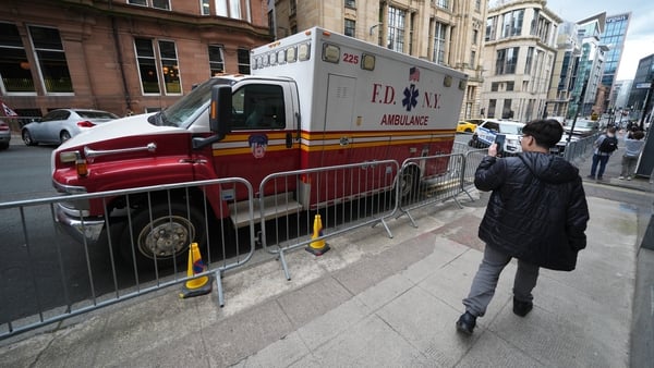 A member of the public takes a photo of a prop of a Fire Department of the City of New York (FDNY) ambulance on set in Glasgow, as workers prepare the area for the filming of the latest film in the Spider-Man franchise, Spider-Man: Brand New Day. The sequ
