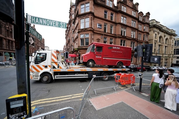Vehicles are moved into position as workers on set in Glasgow prepare the area for the filming of the latest film in the Spider-Man franchise, Spider-Man: Brand New Day. The sequel will see Tom Holland reprise his main role and is set to be directed by Destin Daniel Cretton. Picture date: Friday Aug