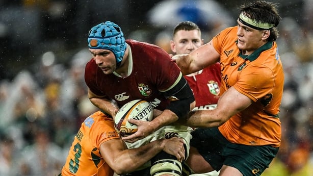 2 August 2025; Tadhg Beirne of British & Irish Lions is tackled by Australia players Joseph-Aukuso Suaalii, left, and Tom Hooper during the third test match between Australia and the British & Irish Lions at Accor Stadium in Sydney, Australia. Photo by Brendan Moran/Sportsfile