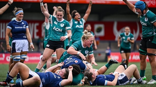 2 August 2025; Sadhbh McGrath of Ireland, obscured, is congratulated by team-mates, including Clíodhna Moloney-MacDonald, centre, after scoring her side's first try during the Women's Rugby World Cup warm-up match between Ireland and Scotland at Virgin Media Park in Cork. Photo by Shauna Clinton/Spo