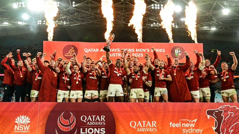 The Lions celebrate with the series trophy in Sydney