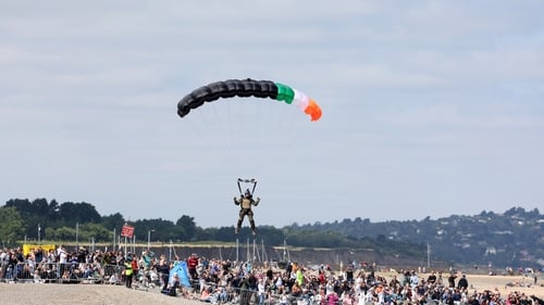 A member of the Defence Forces lands on the beach at the Bray Air Show