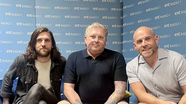 L-R Matthew, Noel and Trev sitting on a sofa with RTÉ Radio 1 branding behind them