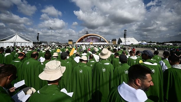 Young faithfuls attend an open-air mass in the Tor Vergata district of Rome, as part of Jubilee of Youth, on August 3, 2025. Pope Leo XIV presided over a final mass in Rome for over one million young people, the culmination of a youth pilgrimage that has drawn Catholics from across the world. (Photo
