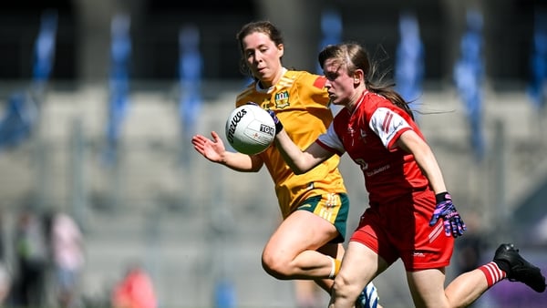Louise Byrne of Louth (r) in action against Laura Agnew of Antrim - 2025 TG4 Junior final