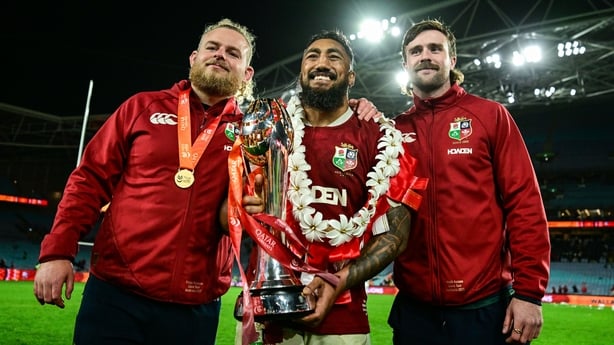 2 August 2025; British & Irish Lions players, from left, Finlay Bealham, Bundee Aki and Mack Hansen with the series trophy after the third test match between Australia and the British & Irish Lions at Accor Stadium in Sydney, Australia. Photo by Brendan Moran/Sportsfile