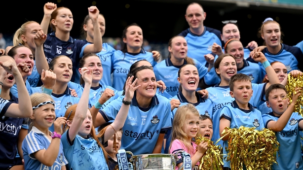 Dublin players, including Hannah Tyrrell, centre, celebrate after their side's victory in the TG4 All-Ireland Ladies Football Senior Championship final match between Dublin and Meath at Croke Park in Dublin