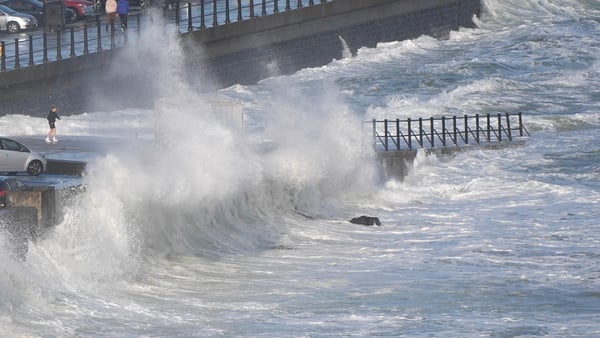 Image shows waves coming over a pier showing wave overtopping