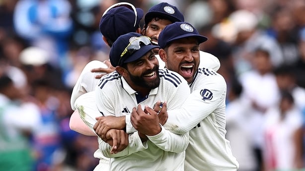 a group of men wearing white uniforms