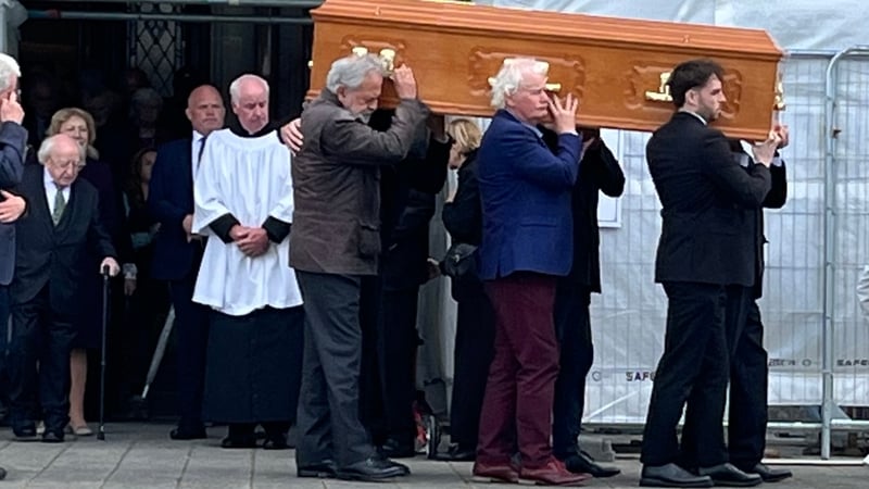 The coffin carrying the remains of Seán Rocks is taken from St Macartan's Cathedral following the funeral mass