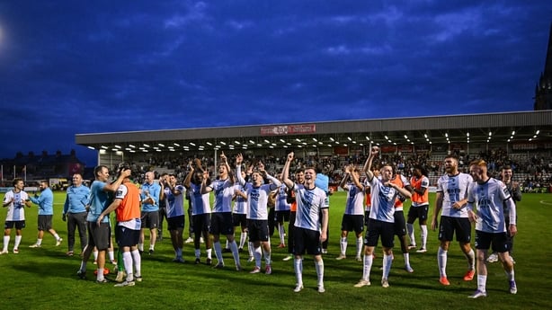 Drogheda United players and management celebrate after their side's victory in the SSE Airtricity Men's Premier Division match between Bohemians and Drogheda United at Dalymount Park in Dublin