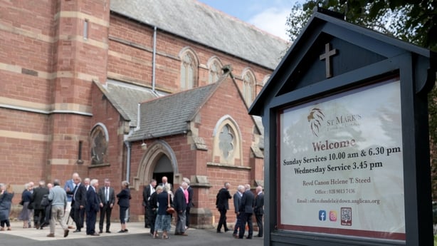 Mourners leave St Mark's Church, Dundela, in East Belfast, after attending the funeral of former Smash Hits and Empire magazine editor Barry McIlheney