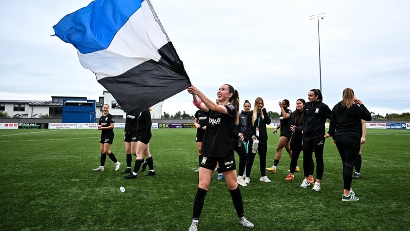 Hannah Waesch waves an Athlone Town flag after their win against Agram