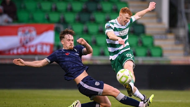 3 August 2025; Rory Gaffney of Shamrock Rovers shoots to score his side's second goal despite the attention of Alex Bannon of Derry City during the SSE Airtricity Men's Premier Division match between Shamrock Rovers and Derry City at Tallaght Stadium in Dublin. Photo by Stephen McCarthy/Sportsfile